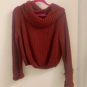 Red knitted chunky sweater with cowl neck